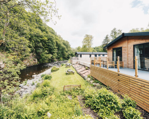 A calm stretch of the River Greta flowing through the Low Briery holiday park grounds in Cumbria