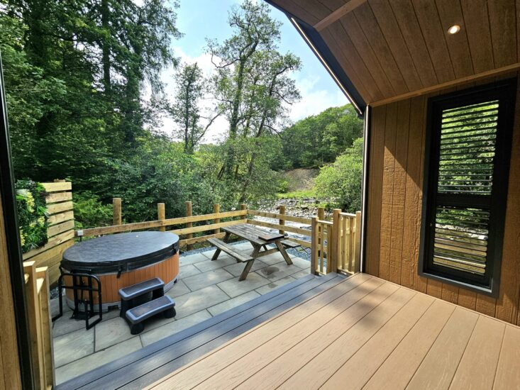 The River Greta flowing through the wooded valley at Low Briery Holiday Park, near Keswick in the Lake District