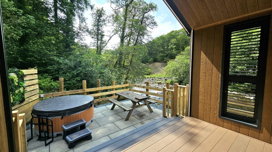The River Greta flowing through the wooded valley at Low Briery Holiday Park, near Keswick in the Lake District